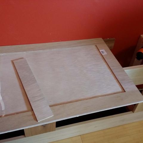 Gluing trim to the door panel.